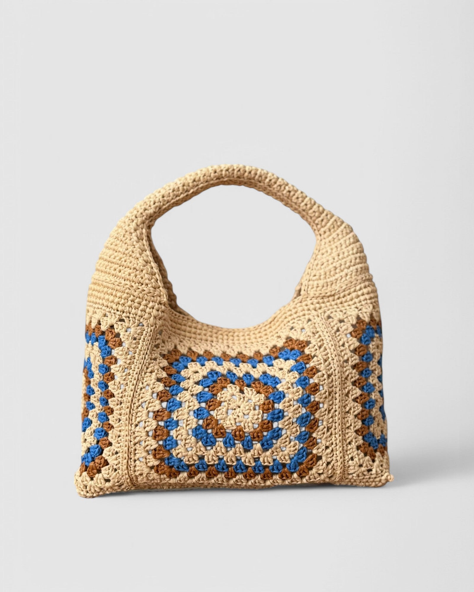 Bolso tejido en rafia de viscosa en color natural azul y tonos tierrra